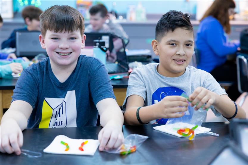Middle school students in science class